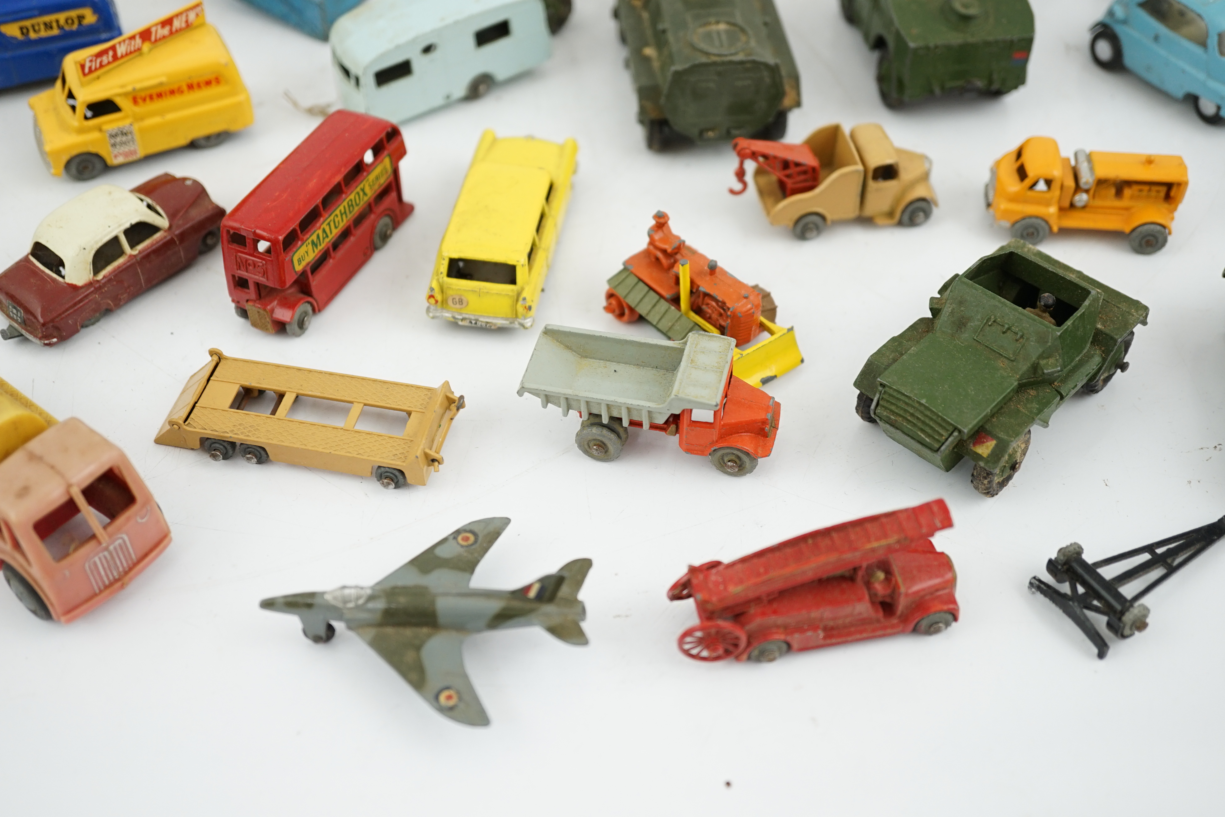 Thirty-eight diecast vehicles by Dinky Toys, Corgi Toys, Matchbox, etc. including a Spot-On BMW Isetta, military Dinky vehicles, Matchbox Series, etc.